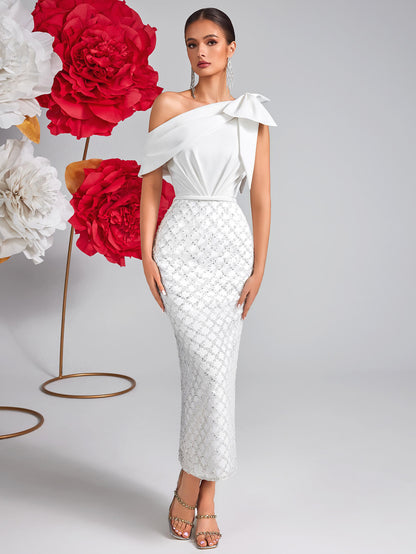 Vestido de malla con lentejuelas y lazo