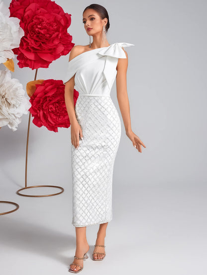 Vestido de malla con lentejuelas y lazo