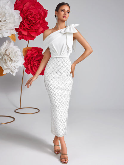 Vestido de malla con lentejuelas y lazo